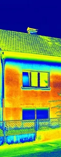 Thermal image of a house showing warm walls and windows